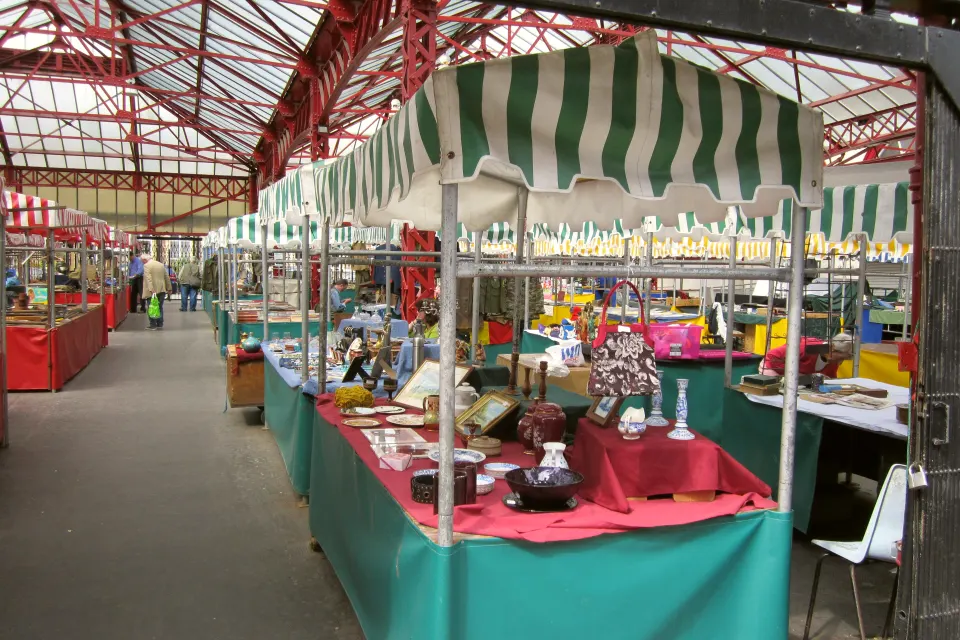 Antiques and bric-a-brac stalls under the iron roof of Altrincham Market
