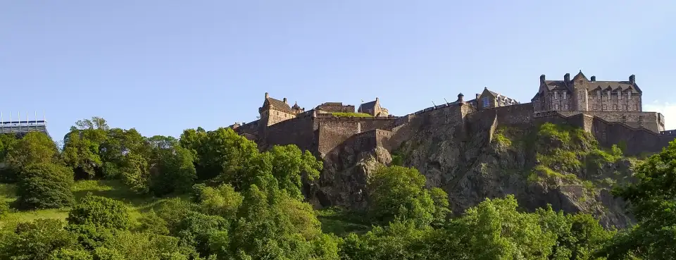 Edinburgh Castle on its rock above the trees of Princes Street Gardens