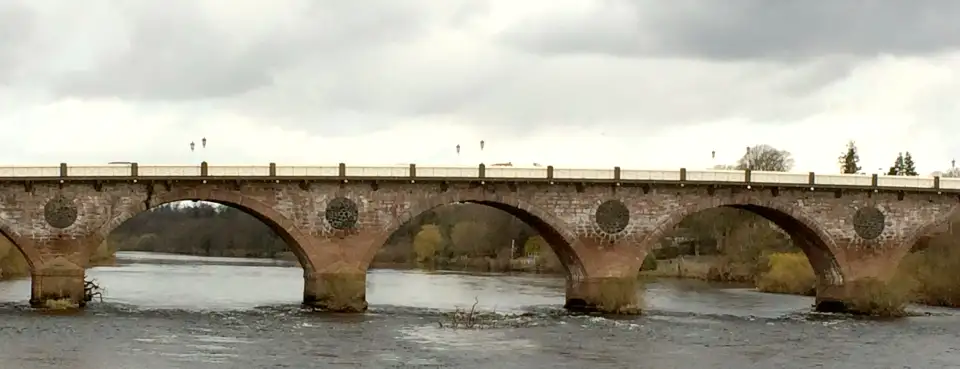 The stone arches of Perth Bridge over the River Tay