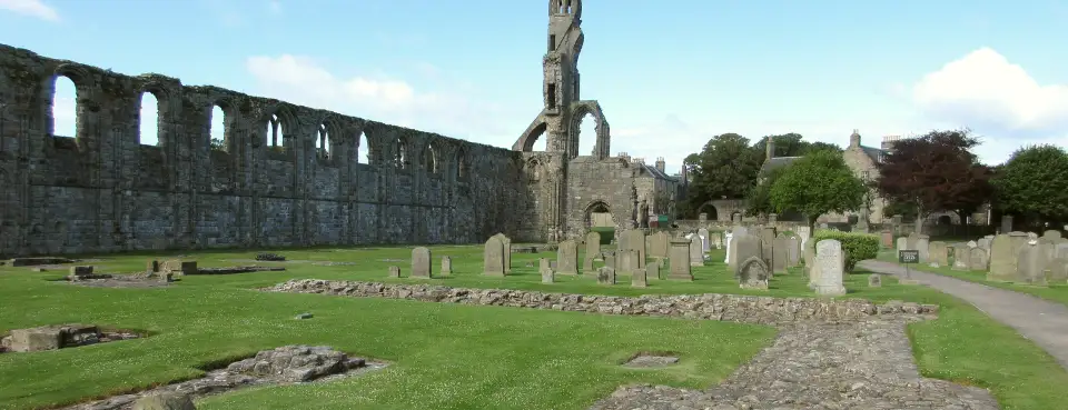 The ruined St Andrews Cathedral and its old graveyard on a sunny day